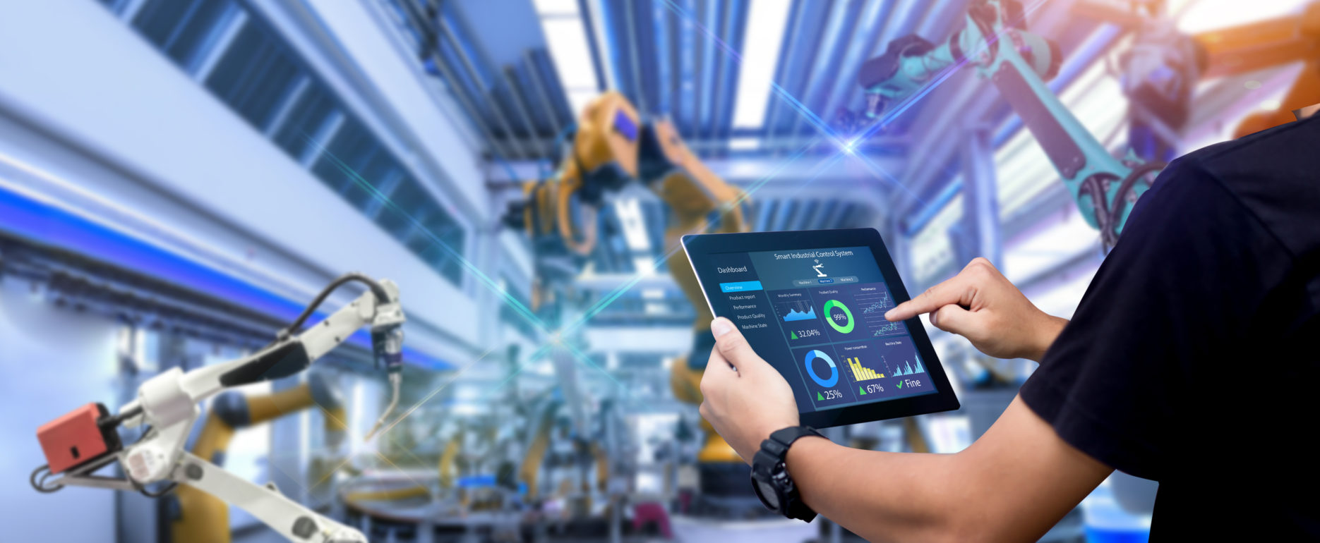 Smart industry control concept.Engineer Hands holding tablet on blurred robot arm automation machine as background