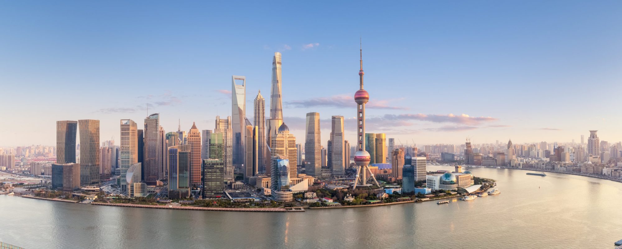 shanghai skyline panorama in sunset, pudong financial center with huangpu river, China.