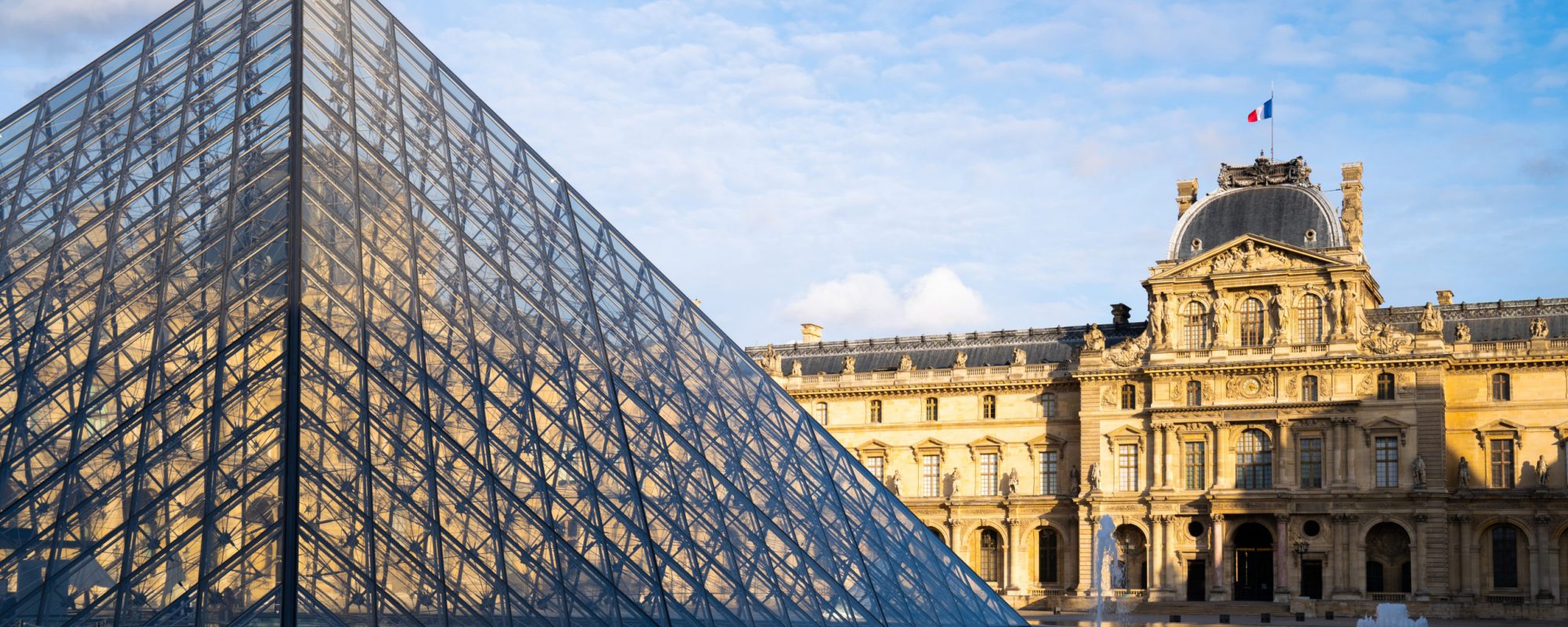 Paris, France - October 15, 2019: Louvre Museum and Pyramid entrance. Famous attraction in Paris.