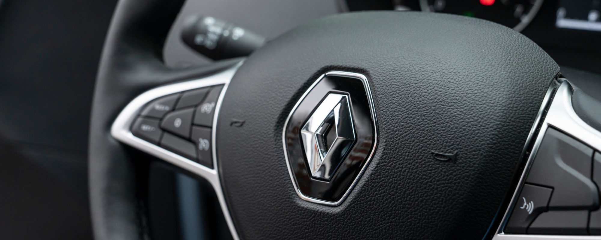 renault logo on the steering wheel in the interior of a new car. renault logo on the steering wheel in the interior of a new car. Krasnoyarsk, Russia, June 26, 2021.